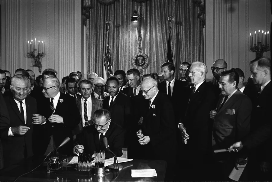 The Civil Rights Movement — Lyndon Johnson signing Civil Rights Act, July 2, 1964